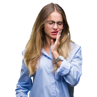 A woman holds her jaw in pain as though she may suffer from TMJ disorder.